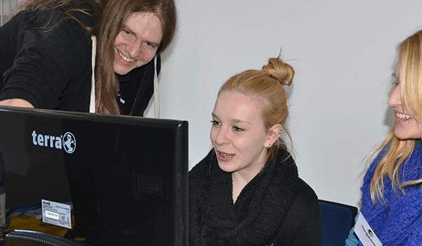 Girls enjoying developing games